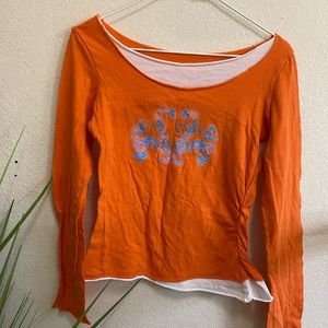 Layered orange long sleeve graphic top